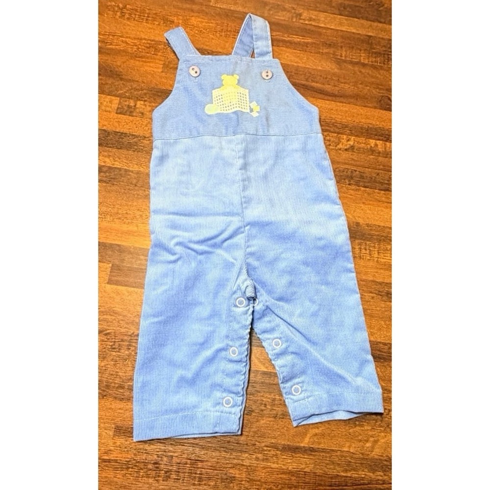 Vintage light blue corduroy bib overalls size 6 months.  With bear in playpen